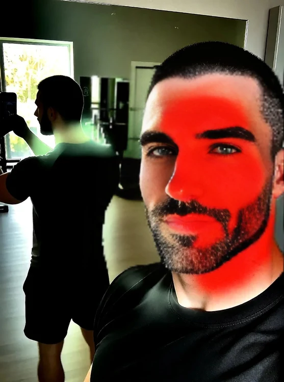 Dante - Selfie-style, gym mirror, Dante in black tee and shorts, spotting a client, casu