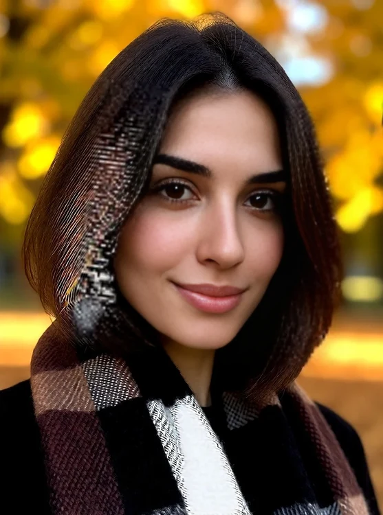 Solene - portrait in an autumn park, golden leaves bokeh, cozy scarf, looking at the came